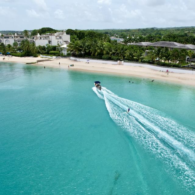 Boat wake along the beach